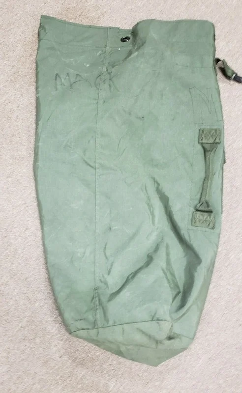 Seller listing photo: Olive military duffel bag